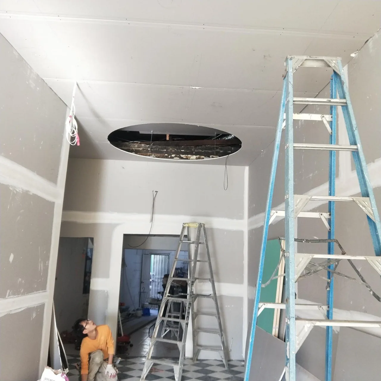 Ceiling repair in progress on the Northern Beaches — large oval section cut out for plasterboard replacement and skim coating