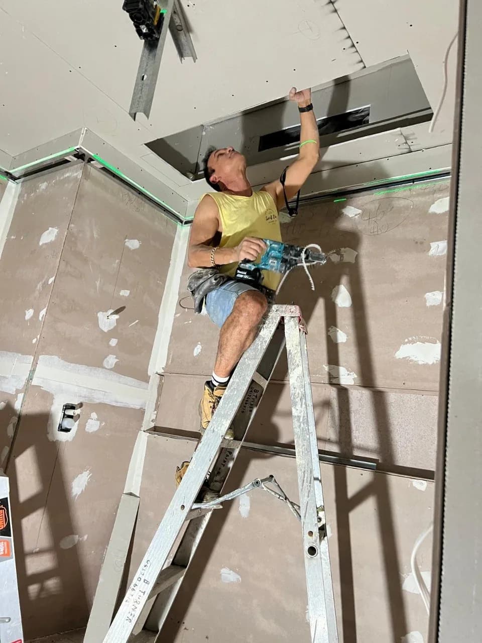 Jack installing gyprock ceiling on the Northern Beaches — NSW Fair Trading licensed plasterer at work